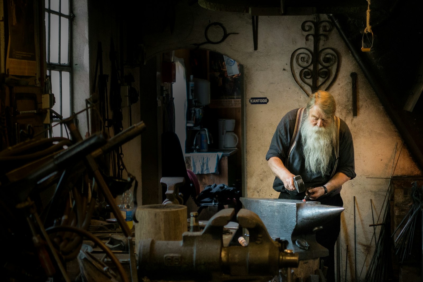 Metalwork workshop with an artisan shaping metal